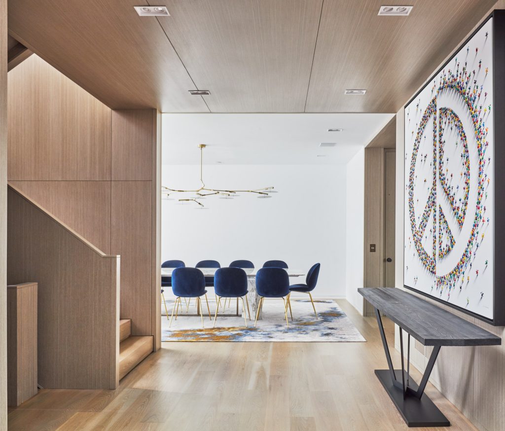 Photography looking into a contemporary dining room through a clad hallway in Mississauga Ontario